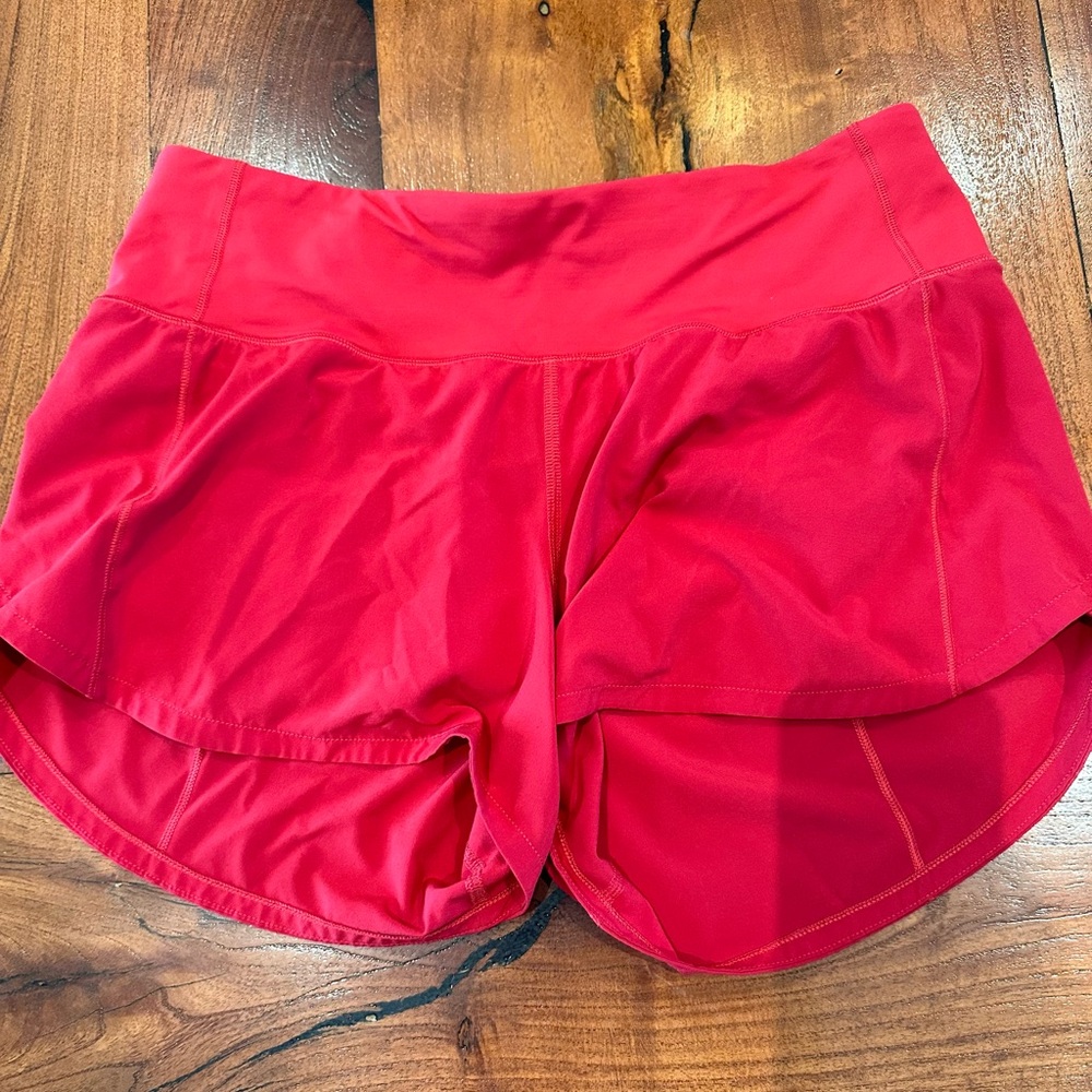 Lululemon 4-inch Speed Up Mid-Rise Lined Short, size 6, color red.